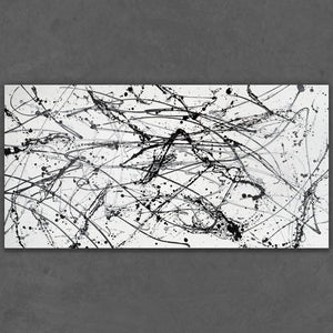 Hand-painted black and white drip art on rolled canvas